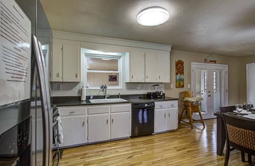 Pigeon Forge Cabin | Bryan's Brookside Bungalow w/Hot Tub, Arcade, Fenced Yard, & next to Stampede!