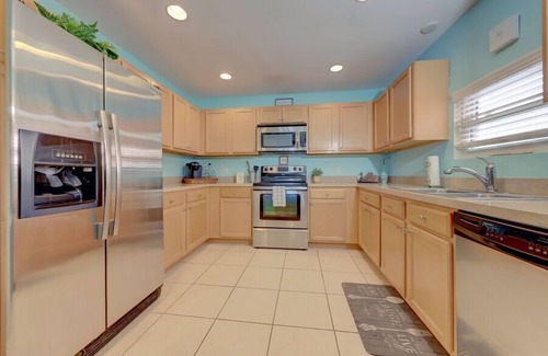 Indian Shores Apartment | Caddy's Boat House with waterway views and balcony sleeps 6
