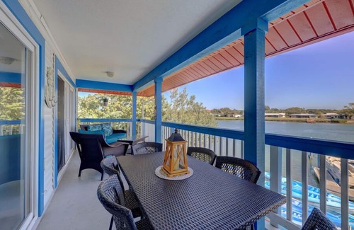 Indian Shores Apartment | Caddy's Boat House with waterway views and balcony sleeps 6