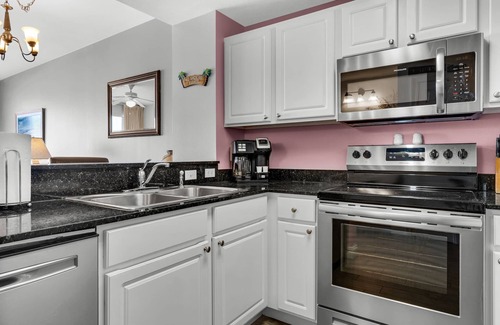 Panama City Beach Condo | Calypso 402 East - Beach Chairs, 2 King Suites, Free Activities Daily!