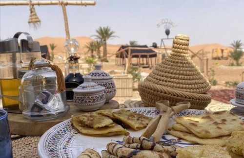 Merzouga RV Rental | Camle trekking land scape and camp fire enjoyable moments i