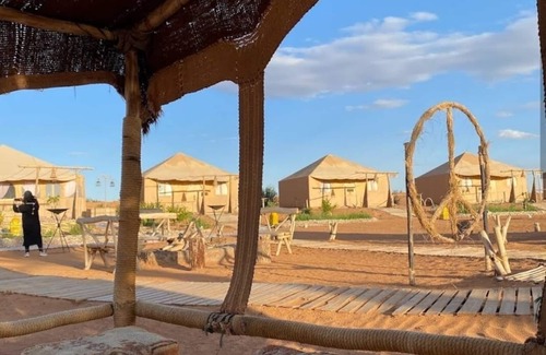 Merzouga RV Rental | Camle trekking land scape and camp fire enjoyable moments i