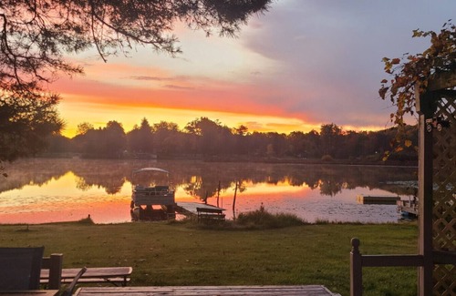 Alto Apartment | Campau Lake 3 Cottages Sunny Days and Sunshine Tiki game house