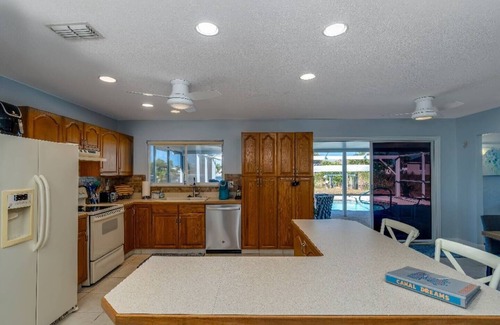 South Gulf Cove House | Canal Dreams a Gorgeous 3 BR/2 BA home with heated pool on the canal