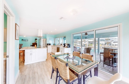 Lochmoor Waterway Estates House | Canal-front home with heated saltwater pool, dock, grill, & covered patio