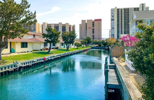 North Ocean City House | Canal-front home with private dock, deck, grill, central AC, and free WiFi