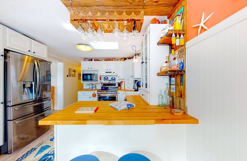 Montego Bay House | Canal front home with free WiFi, deck, private dock, shared pool & tennis