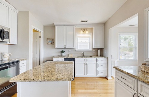 West Beach House | Canal-front house with private washer/driver, deck and outdoor shower