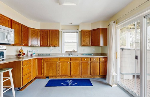 West Beach House | Canal-front house with private washer/driver, deck and outdoor shower