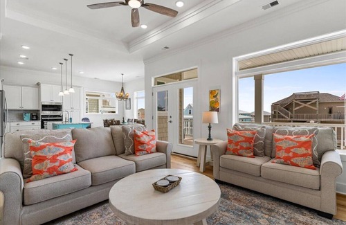 Ocean Isle Beach House | Carefree Highway is a breathtaking 5-bedroom, 5-bathroom home in Ocean Isle Beach, offering stunning ocean views, a private pool, and an elevator!