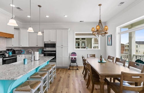 Ocean Isle Beach House | Carefree Highway is a breathtaking 5-bedroom, 5-bathroom home in Ocean Isle Beach, offering stunning ocean views, a private pool, and an elevator!