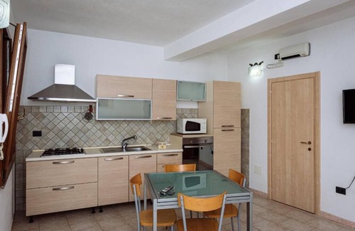Porto Torres Apartment | Casa Maestrale - Holiday Home in residential area