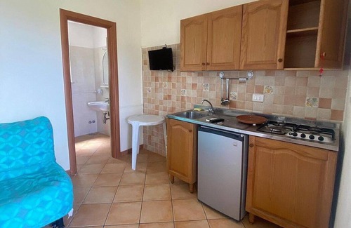 Marina di Puolo House | Casa Milli A: A cozy apartment situated on a promontory facing the sea.