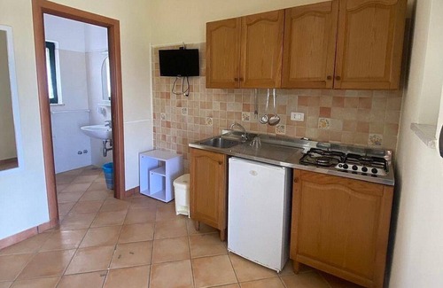 Marina di Puolo House | Casa Milli B: A cozy apartment situated on a promontory facing the sea.