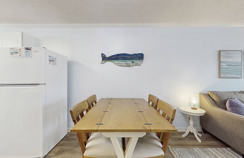 Fort Morgan Condo | Casual condo steps from the beach with AC, balcony, resort pools, & free WiFi