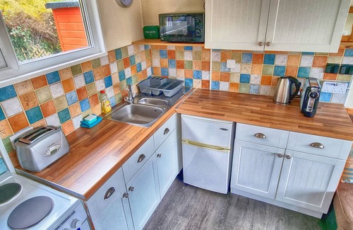 Mumbles Ski Chalet | Caswell Beach Chalet located in Gower Peninsula