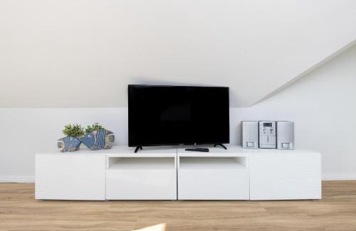 Hohe Dune Apartment | CBlue "Ferienhaus am Yachthafen - Yacht"