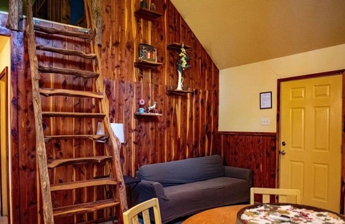 Lindale Cabin | Cedar Loft-This rustic retreat is just a short drive from fishing and shopping