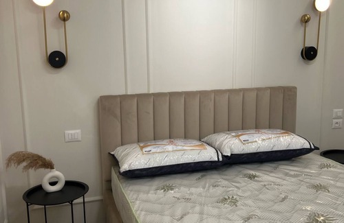 Tirana Apartment | Central Tirana 1-Bedroom Apartment - Modern Rental with Free Wi-Fi & Balcony