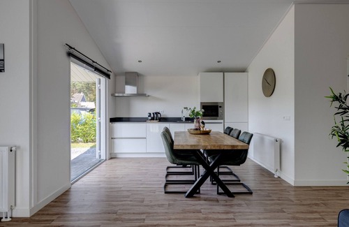 Municipality of Veldhoven Ski Chalet | Chalet by Pond in Eindhoven Holiday Park