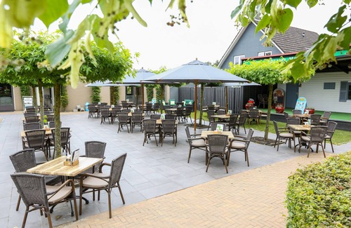 Municipality of Veldhoven Ski Chalet | Chalet by Pond in Eindhoven Holiday Park