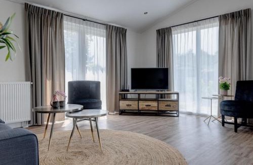 Municipality of Veldhoven Ski Chalet | Chalet by Pond in Eindhoven Holiday Park