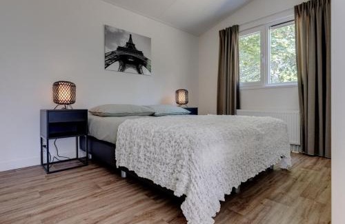 Municipality of Veldhoven Ski Chalet | Chalet by Pond in Eindhoven Holiday Park