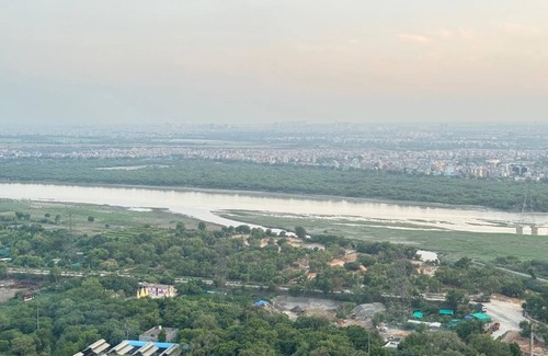 Noida Apartment | Charming 1-bedroom city and river view apartment in pleasant Noida with WiFi, AC