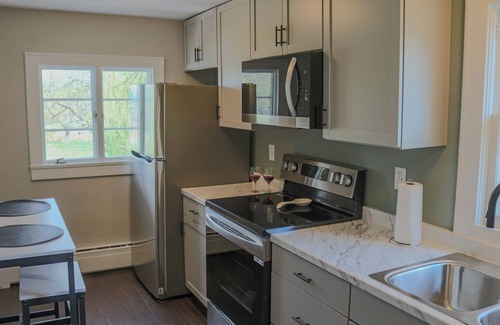 Romney Apartment | Charming 2BR Top-Floor Suite Renovated 1870 Home Porch, Fire Pit, Full Amenities
