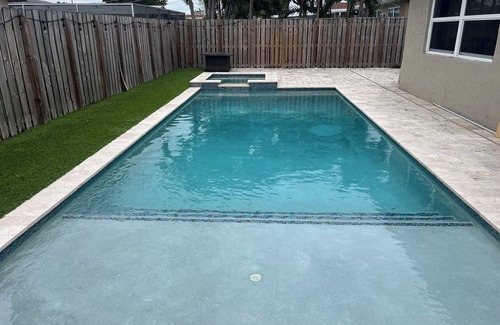 Sunrise House | Charming 3/2 house with heated pool/spa, just 2 miles from Sawgrass Mills Mall!