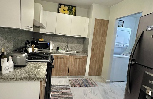 Santo Domingo Oeste Apartment | Charming 3-bedroom apartment with WiFi, AC and a picuzzy in Santo Domingo Oeste.