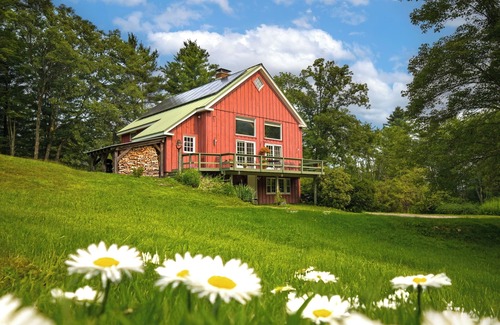 Williamstown House | Charming barn ski house with exposed rustic beams and cathedral ceilings.