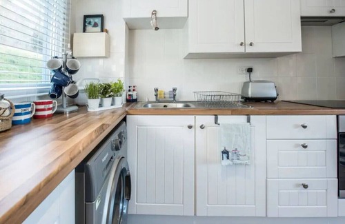 Pembroke House | Charming Beach Chalet with Balcony & Sea Views