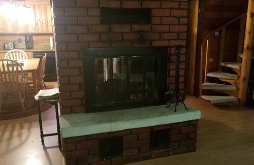 Rowleys Bay House | Charming cedar log cabin nestled in the woods, footsteps from Rowley's Bay