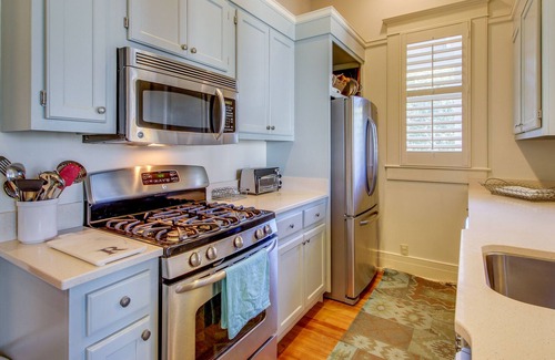 Saint Simons Island Cottage | Charming cottage with covered balcony, incredible views & pool
