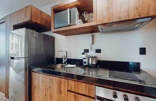 Gonzalo Guerrero Condo | Charming condo with rooftop pool, scenic balcony, & kitchenette