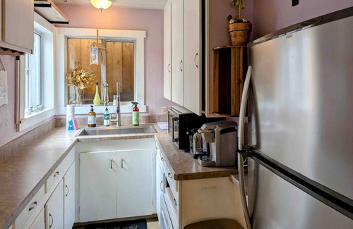 West Slope Cottage | Charming cottage with a private hot tub, gas grill, & furnished patio