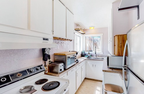 West Slope Cottage | Charming cottage with a private hot tub, gas grill, & furnished patio