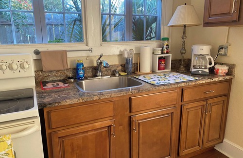 Polk City Cottage | Charming Historic Cottage with Cozy Porch and Garden Retreat