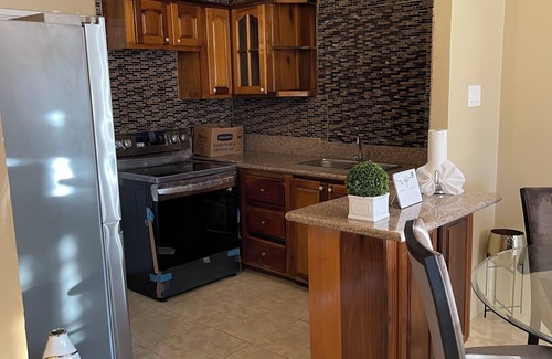 Florence Hall Village House | Charming family friendly 2-bedroom house in StoneBrook Estate with WiFi, AC