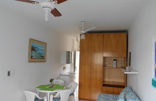 Pitangueiras Apartment | Charming kitnet ideal for couple 100 meters from the beach in Pitangueiras
