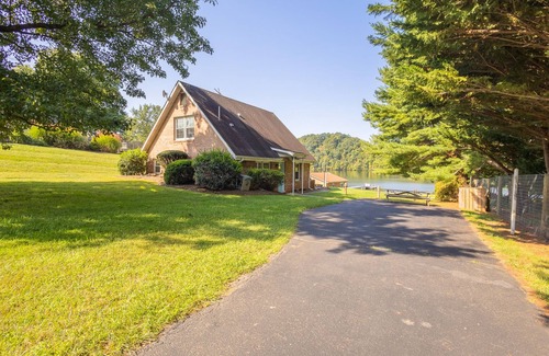 Ingles House | Charming lakefront retreat with cozy interiors, private dock, fire pit, and breathtaking water view