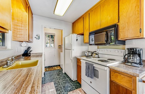 Anchor Bay House | Charming oceanfront home, private hot tub, & water views