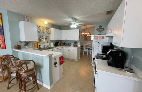 Lady Lake House | Charming Retreat with Lanai & Preserve Views, Golf Cart Included!