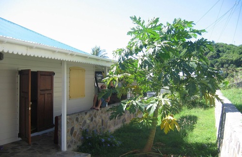 Friendship House | Charming seaside villa with wraparound veranda, ocean views and wind.