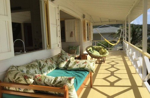 Friendship House | Charming seaside villa with wraparound veranda, ocean views and wind.