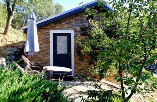 Midpines Cabin | Charming stone clad cabin with views off Highway 140 towards Yosemite