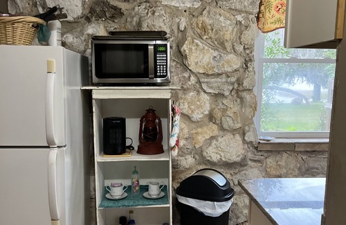 Hernando Cottage | Cheerful water front stone cottage. With beach. on bike trail.