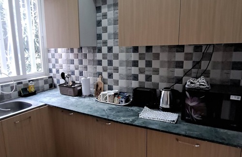 Embassy Golf Links Business Park Apartment | Chez Oly fully furnished set in a quiet, green neighborhood & centrally located!