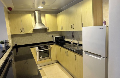 Doha Apartment | Chic 1-bedroom apartment with AC, fitness room, WiFi in enchanting Doha